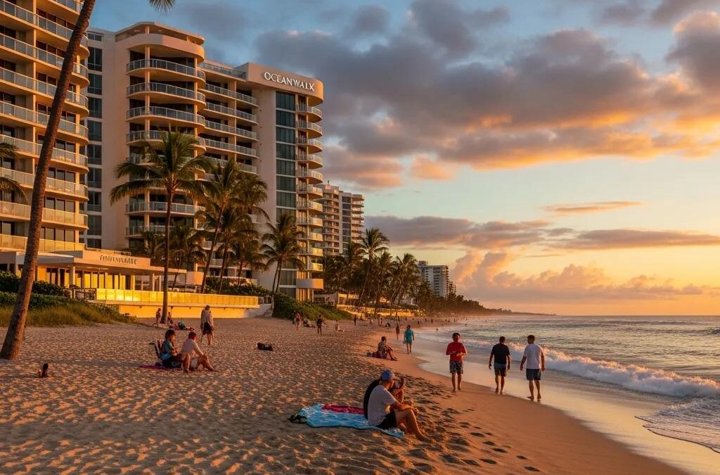 Oceanwalk Luxury Condos along Atlantic Beach at sunset, featuring beachfront views, palm trees, and people enjoying the sandy shore.